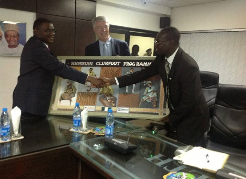 Honourable Minister for Health Prof Onyebuchi Chukwu Congratulating Dr OO Adegbehingbe ,Abuja 2012